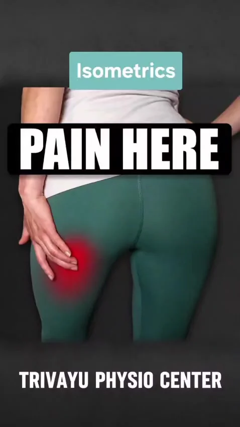 Close-up of a hip in green leggings, a hand resting on it, red pain marker overlaid