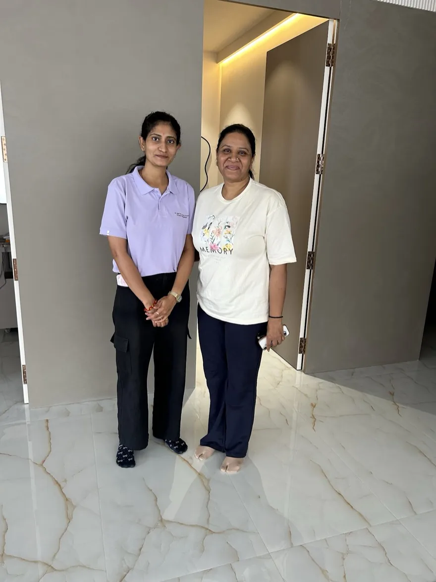 A senior physiotherapist with a patient at Trivayu Physio Center