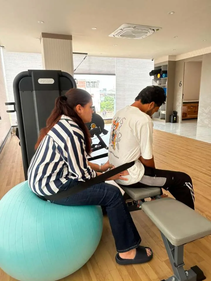 Hands-on manual therapy during a rehab session at Trivayu Physio Center